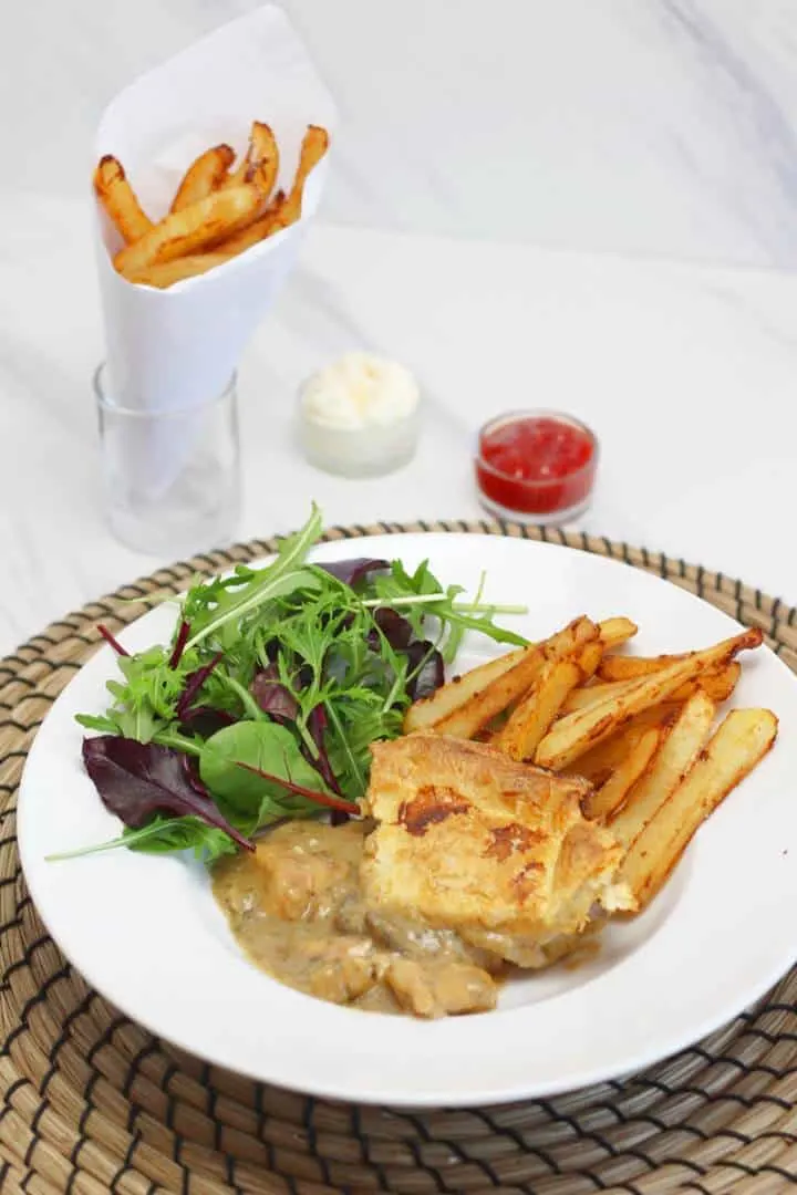 chicken casserole with belgian frites and salad