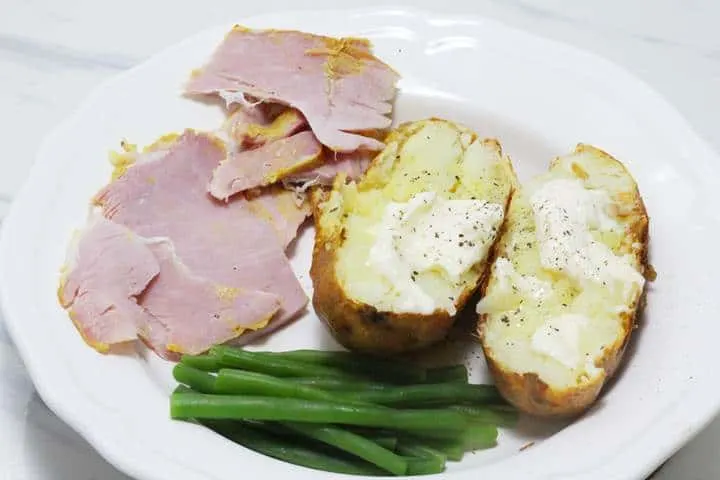 bakes potato with boiled ham