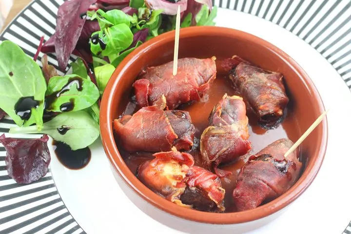 prosciutto wrapped dates with goats cheese